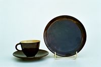 Coffeecup on  saucer  with plate, 1920s,    glaze :  cocoabrown,    cup : inside  white/ transparent  on  white stoneware
